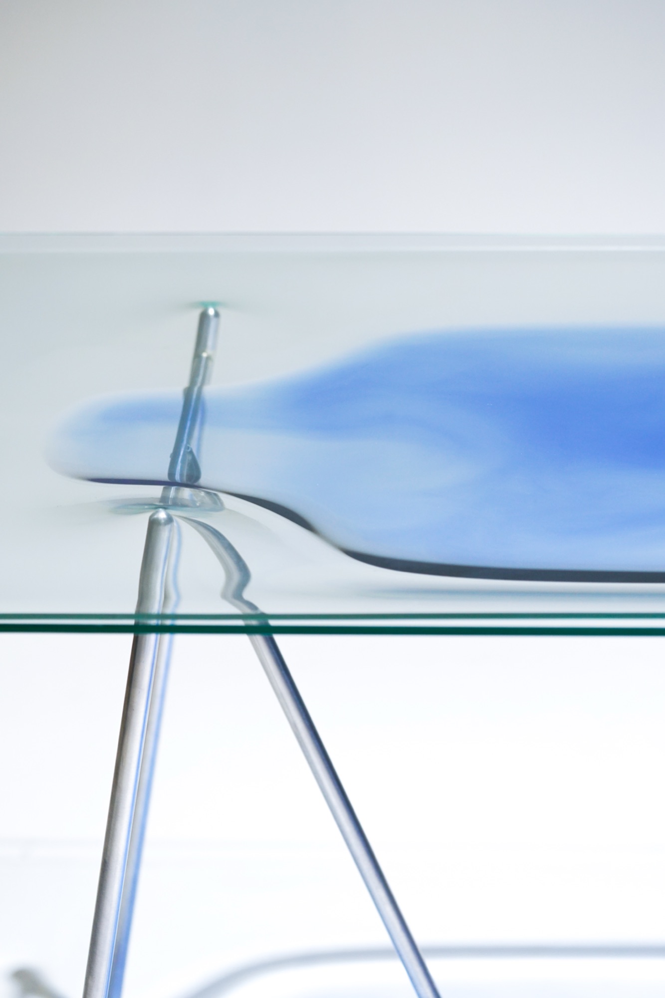 sensitive surface — liquid-filled table registering vibrations